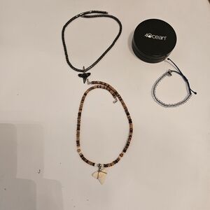 Two Shark Tooth Necklaces a Black and Brown Beaded Necklace and Black Beaded Set